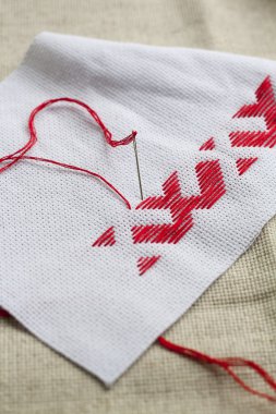 Ukrainian national red embroidery thread, selective focus