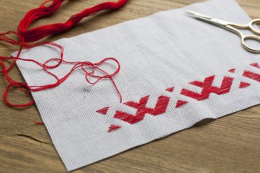 Ukrainian national red embroidery thread, selective focus