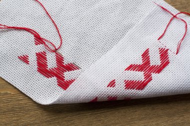 Ukrainian national red embroidery thread, selective focus