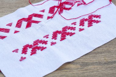Ukrainian national red embroidery thread, selective focus