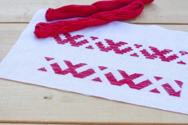 Ukrainian national red embroidery thread, selective focus
