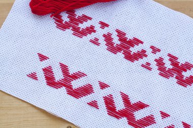 Ukrainian national red embroidery thread, selective focus