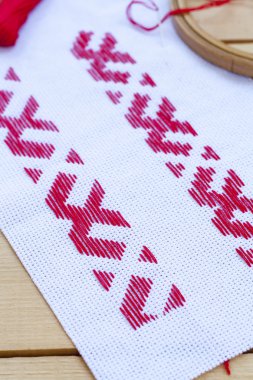 Ukrainian national red embroidery thread, selective focus