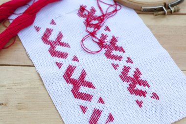 Ukrainian national red embroidery thread, selective focus