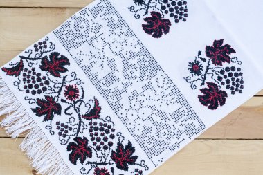 Towel for the icon with the red-black Ukrainian embroidery, selective focus