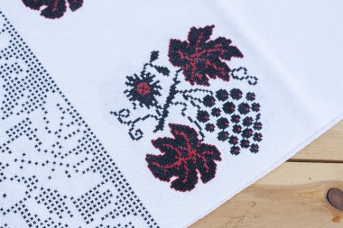 Towel for the icon with the red-black Ukrainian embroidery, selective focus