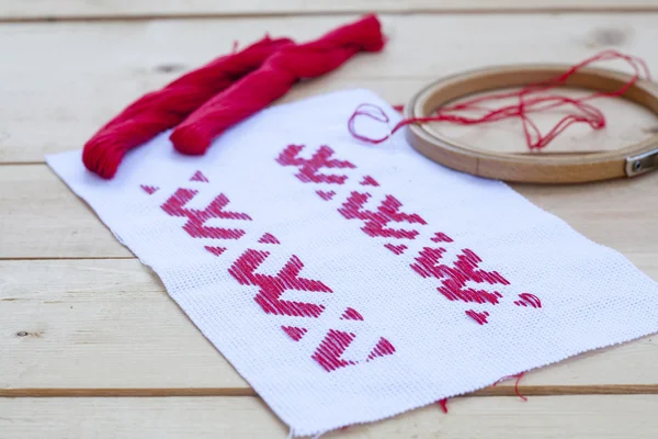 Ukrainian national red embroidery thread, selective focus — Stock Photo, Image