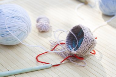Color woolen clews for knitting and crochet woven piece close-up, selective focus