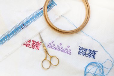 Samples Ukrainian embroidery, unfinished work in progress and tools for embroidery