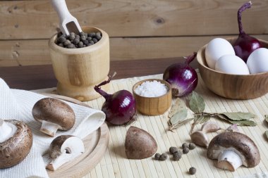 Fresh eggs with champignon mushrooms, vegetables and spices