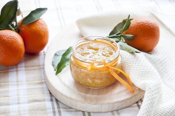 Orange jam in glass jar, selective focus. — Stock Photo, Image