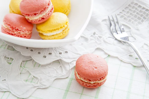 Colorful french macaroons in white dish with soft vintage color — Stock Photo, Image