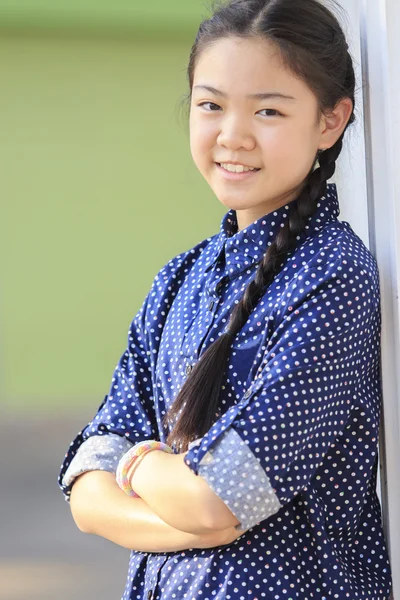 Portrait of thai 12s years girl wearing blue shirt standing out — Stock Photo, Image