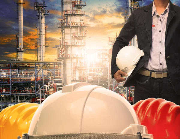 Engineering man with white safety helmet standing in front of oi — Stock Photo, Image