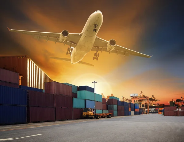 Cargo plane flying above container dock and ship port use for tr — Stock Photo, Image