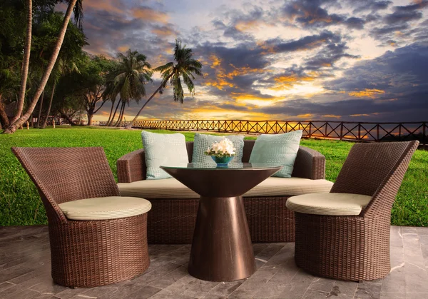 Rattan chairs in outdoor terrace living room against beautiful s — Stock Photo, Image