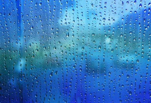 Close up textura de fundo gota de água no espelho azul usar como — Fotografia de Stock
