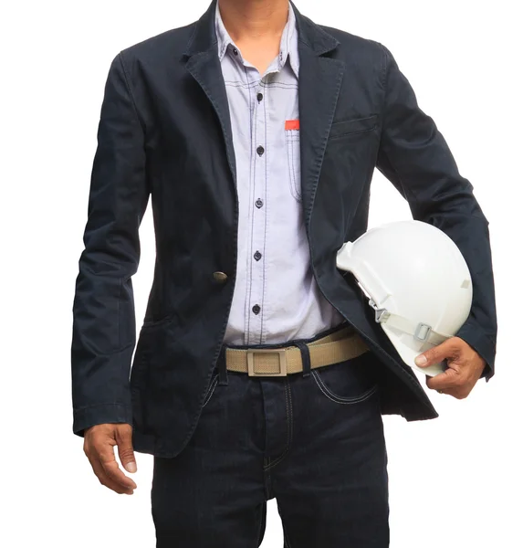 Young working man and safety helmet standing isolated white background — Stock Photo, Image