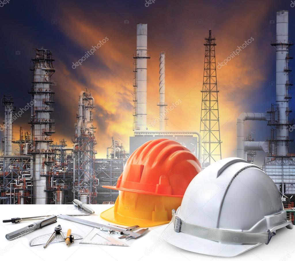 Engineer working table in oil refinery plant heavy petrochemical