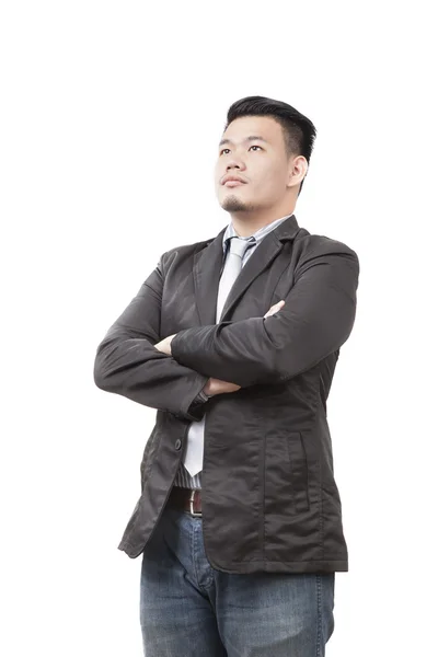Обличчя молодого азіатського чоловіка в західному костюмі стоїть і дивиться — стокове фото