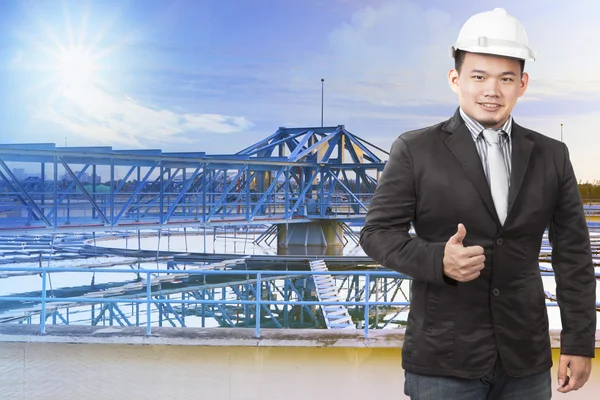 Environmental engineering man standing in front of waterworks in — Stock Photo, Image