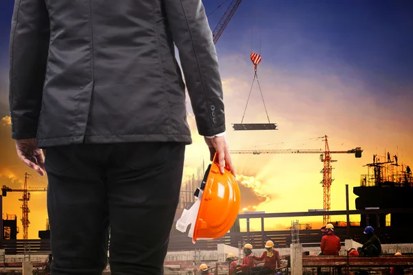 Engineering man holding safety helmet and working in building co — Stock Photo, Image