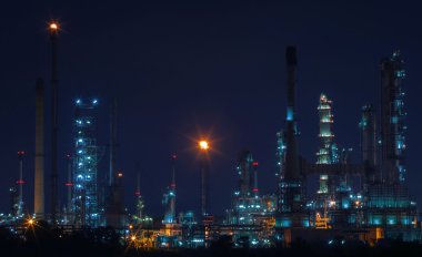 Beautiful night scene landscape of oil and gas refinery factory clipart
