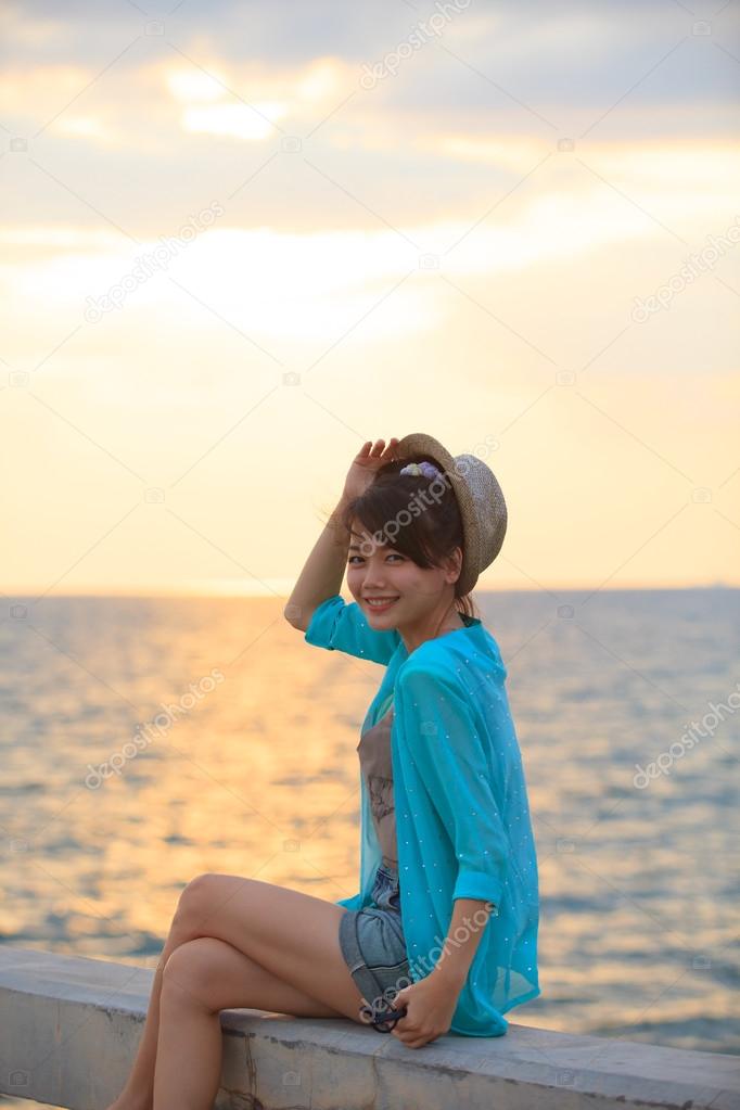 portrait of beautiful and happy emotion teenager wearing straw h