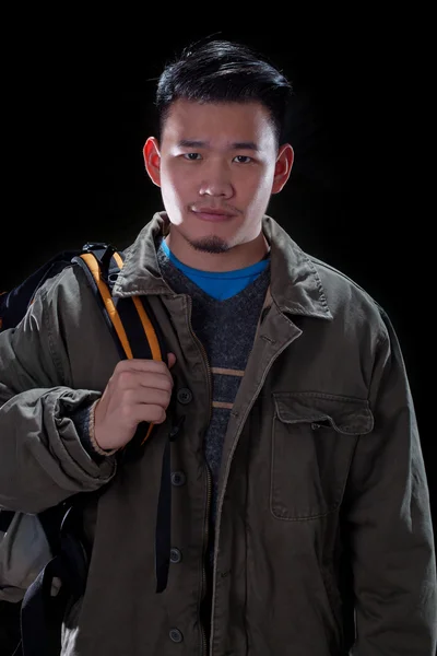 Young asian man carrying back pack use for people traveling and — Stock Photo, Image