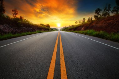 Beautiful sun rising sky with asphalt highways road in rural sce clipart