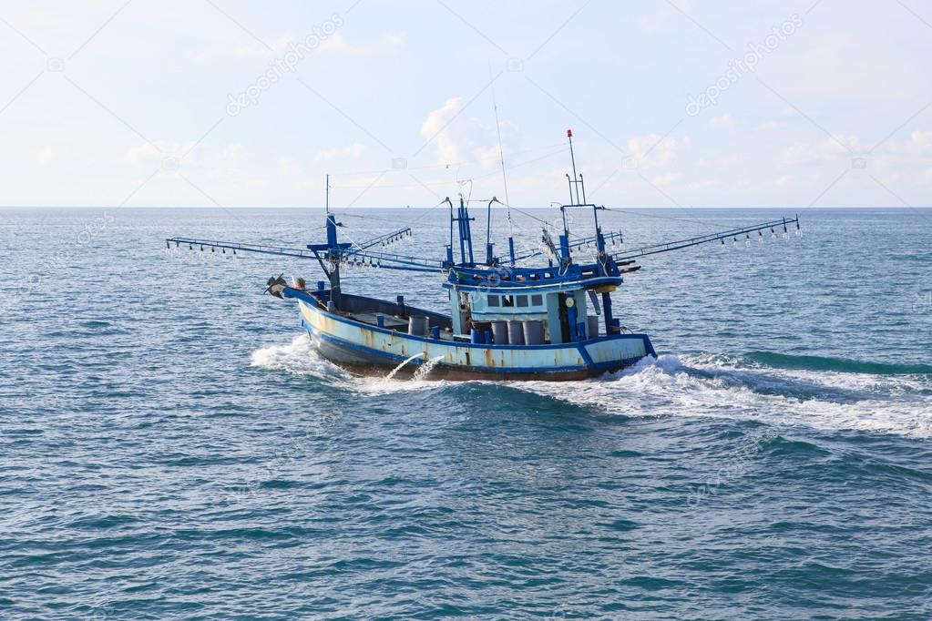 thailand local fishery boat running over blue sea water 