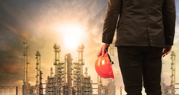 Engineering man with safety helmet standing in industry estate a — Stock Photo, Image