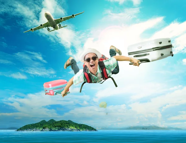 Young man flying from passenger plane to natural destination isl — Stock Photo, Image