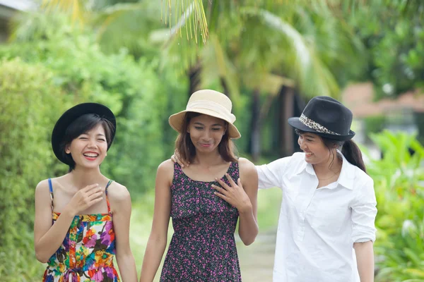 Portrait of asian woman friend group walking in green park and t — Stock Photo, Image