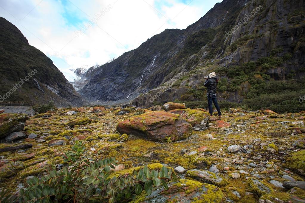 photographer take a photograph in franz josef glacier trail impo