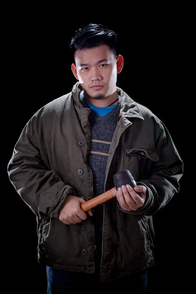 Aggressive bad boy holding hammer in hand — Stock Photo, Image