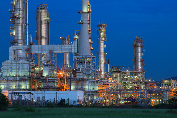beautiful lighting of oil refinery palnt against dusky blue sky