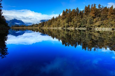 reflection scenic of lake matheson in south island new zealand clipart