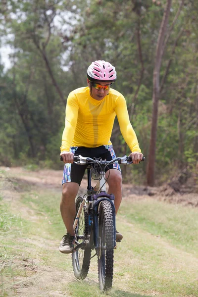 Man and mountain bike riding in jungle track use for bicycle spo — Stock Photo, Image