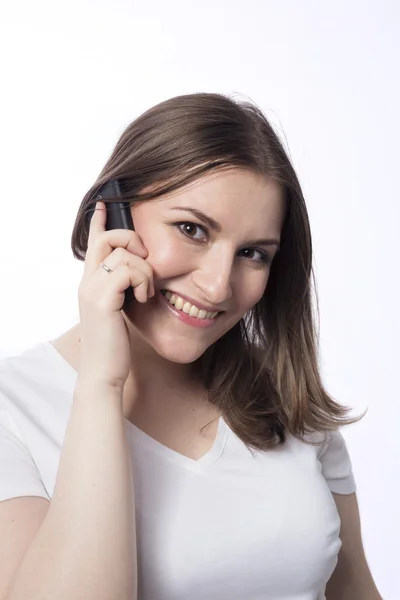 Young woman talk to mobile phone Royalty Free Stock Images