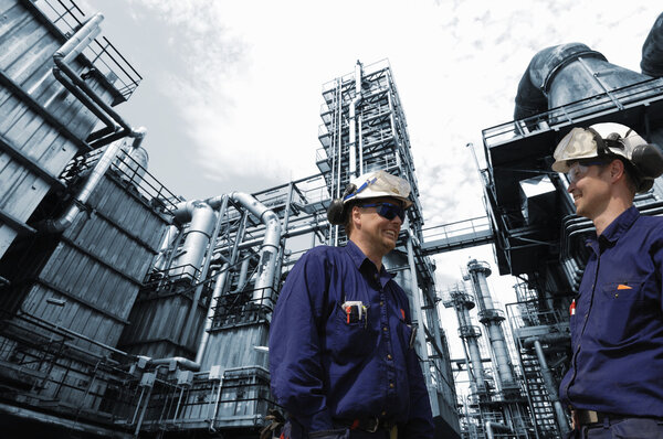 oil and gas workers inside refinery industry