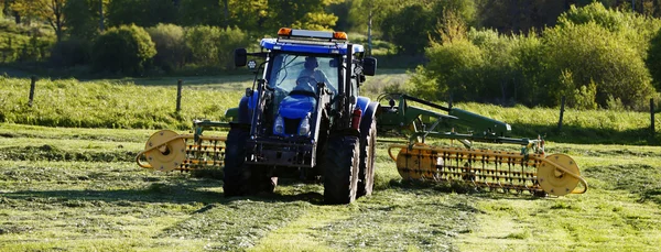 Farming tractor and plow in action — Stock Photo, Image