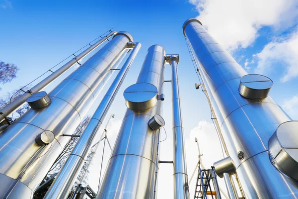 Large oil and gas pipes against clear blue sky — Stock Photo, Image