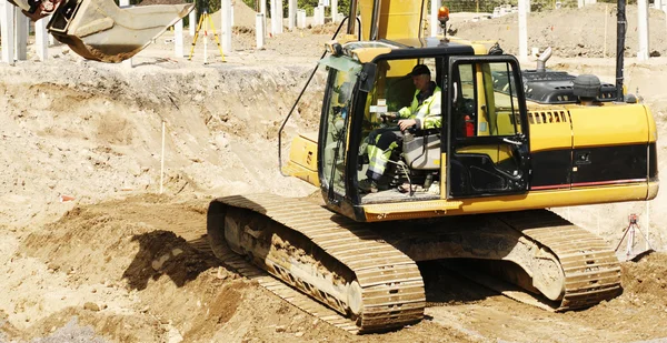 Bulldoxer és a vezető a közelképekhez — Stock Fotó