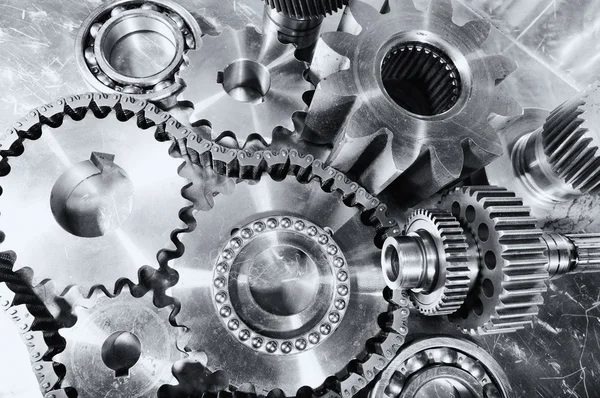 Cogwheels, gears and timing chains, titanium and steel — Stock Photo, Image