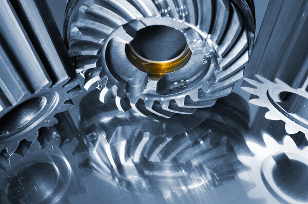 Cogwheels, titanium, steel and oil