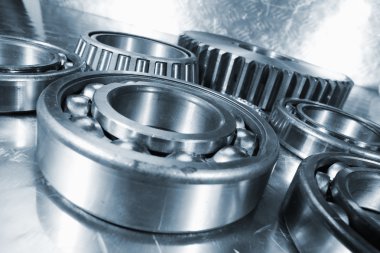Titanium and steel ball-bearings and cogs clipart