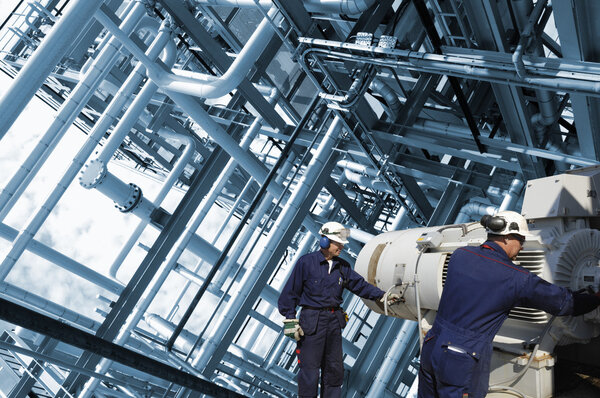 oil and gas workers inside refinery industry