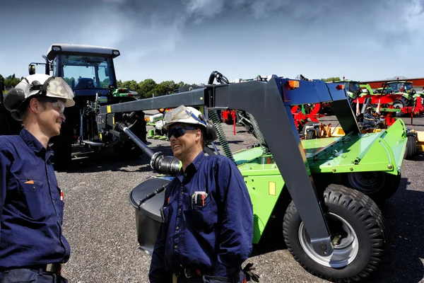 Two farmers with their machinery — Stock Photo, Image