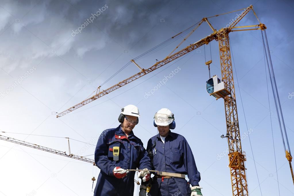 building workers and construction site